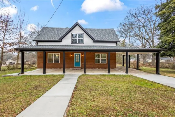 a front view of a house with a yard