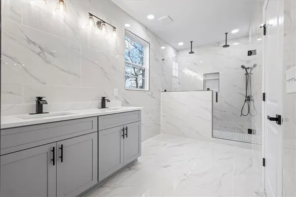 a bathroom view with a toilet and a shower