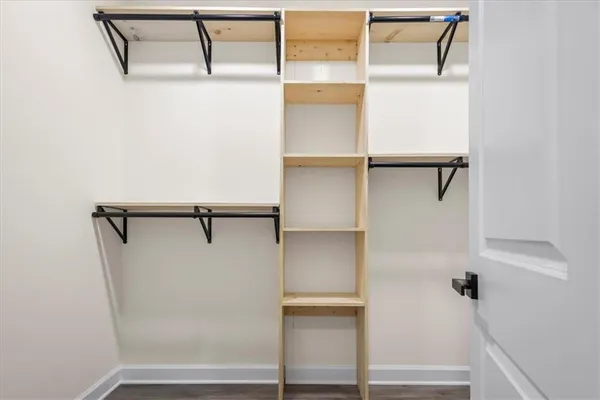 a bathroom with a double vanity sink a mirror and a shower