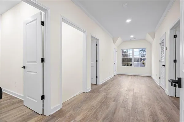 a bathroom with a granite countertop toilet and a sink
