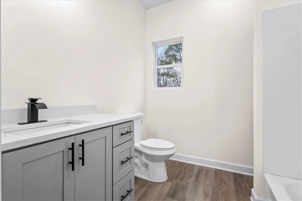 a bathroom with a bathtub and a sink