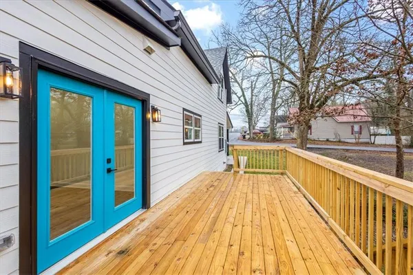 a house that has a tree in front of it