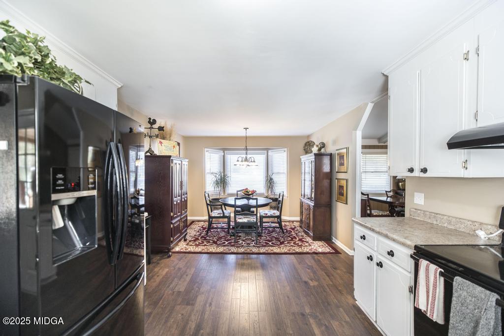 559 Stone Edge Road Macon, GA 31210 - Photo 15 of 40 a kitchen with stainless steel appliances granite countertop a refrigerator and a stove top oven