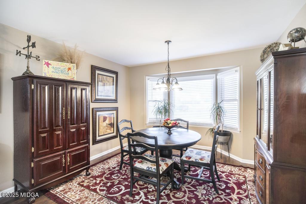 559 Stone Edge Road Macon, GA 31210 - Photo 16 of 40 a view of a dining room with furniture