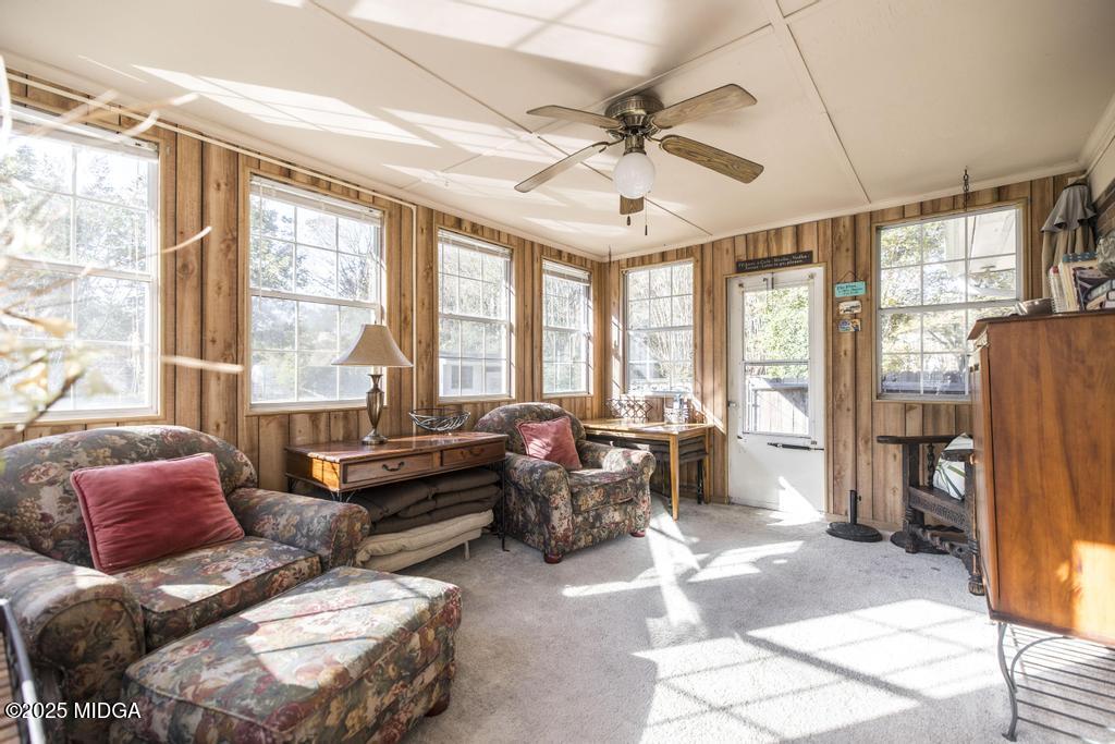 559 Stone Edge Road Macon, GA 31210 - Photo 20 of 40 a living room with furniture and a large window