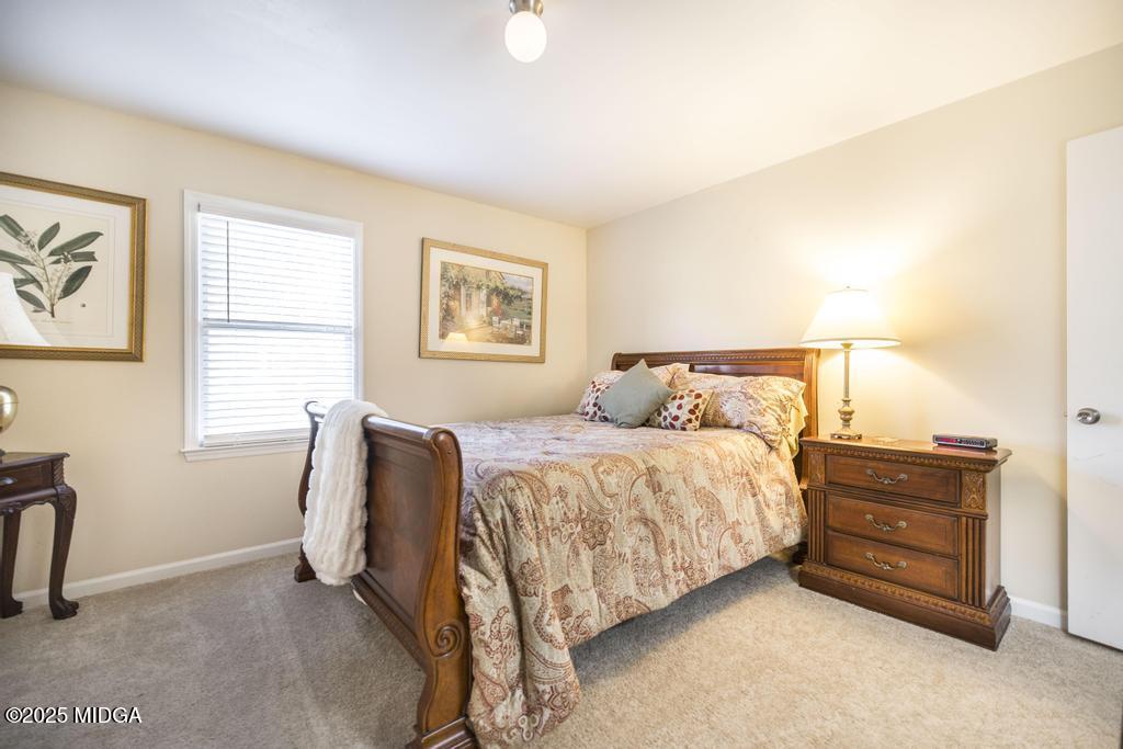 559 Stone Edge Road Macon, GA 31210 - Photo 24 of 40 a bedroom with a bed dresser and window