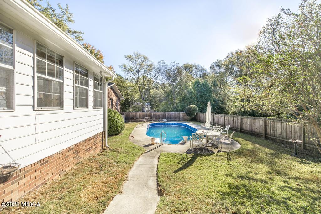 559 Stone Edge Road Macon, GA 31210 - Photo 33 of 40 a view of a backyard with plants and patio