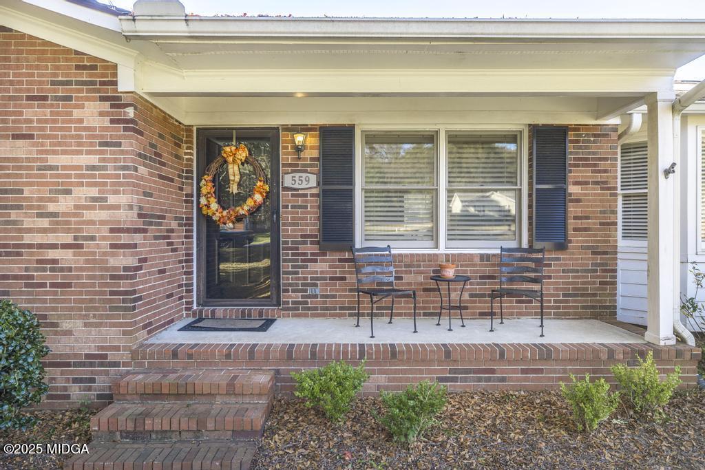 559 Stone Edge Road Macon, GA 31210 - Photo 6 of 40 a front view of a house with a garden