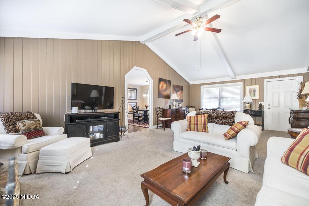 559 Stone Edge Road Macon, GA 31210 - Photo 10 of 40 a living room with furniture a flat screen tv and a window