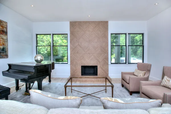 a living room with furniture and a fireplace