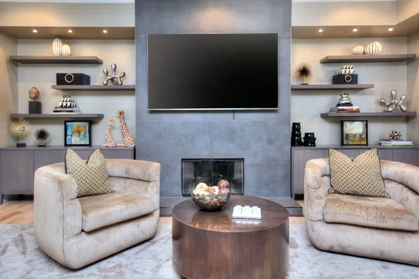 a living room with furniture and a fireplace
