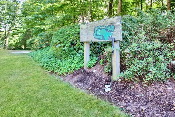 a sign that is sitting in the grass