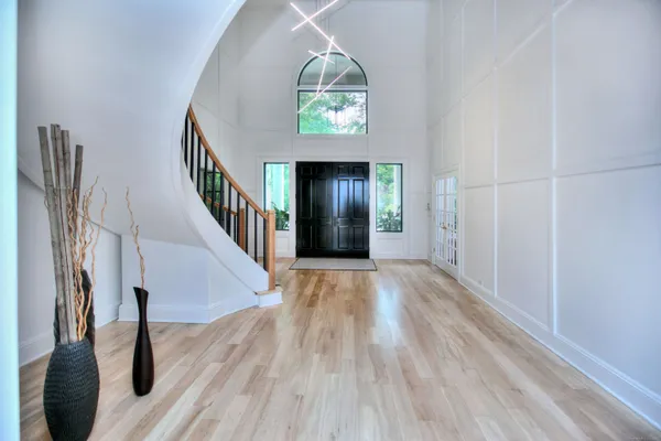a view of entryway with wooden floor
