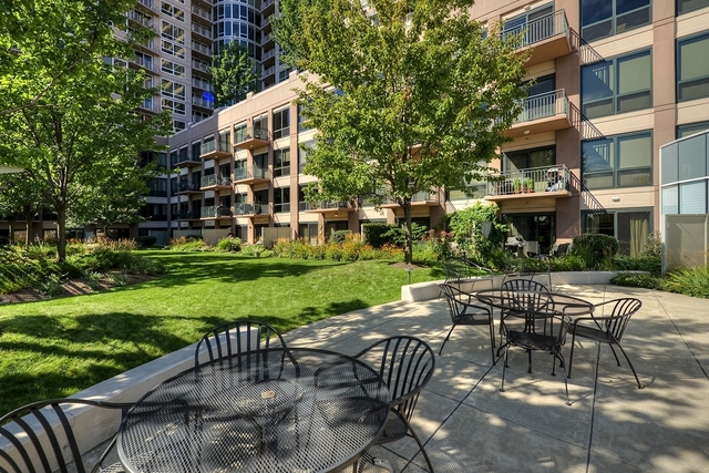807 Davis Street, Unit 1607 Evanston, IL 60201 - Photo 24 of 28 a view of a patio with a yard