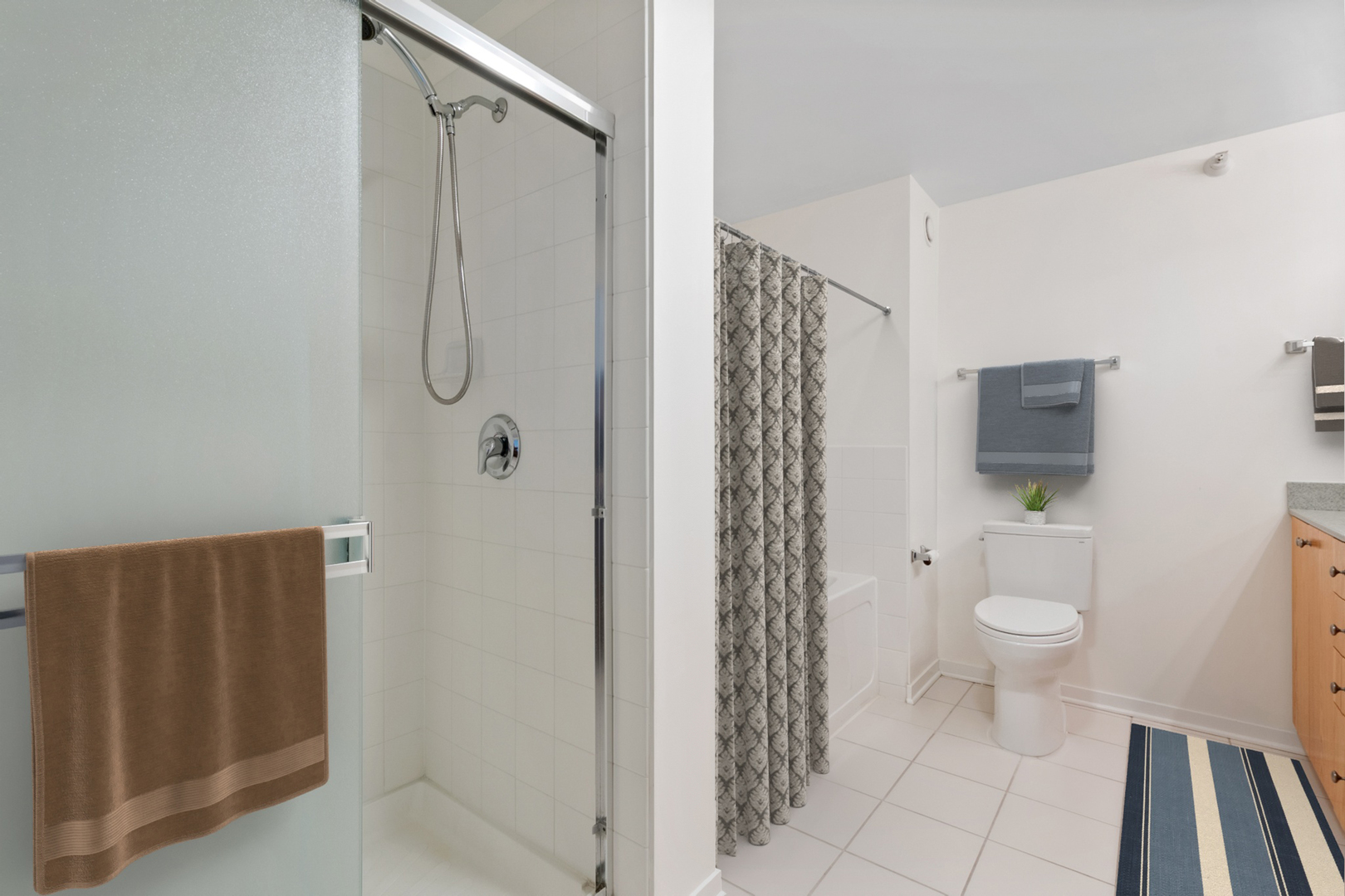 807 Davis Street, Unit 1607 Evanston, IL 60201 - Photo 9 of 28 a bathroom with a granite countertop shower and a toilet