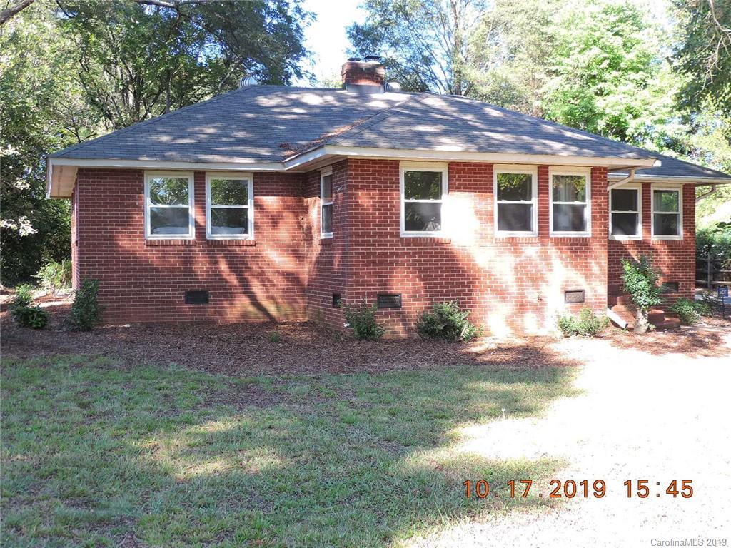 5908 Tuckaseegee Road Charlotte, NC 28208 - Photo 2 of 30 a front view of a house with garden