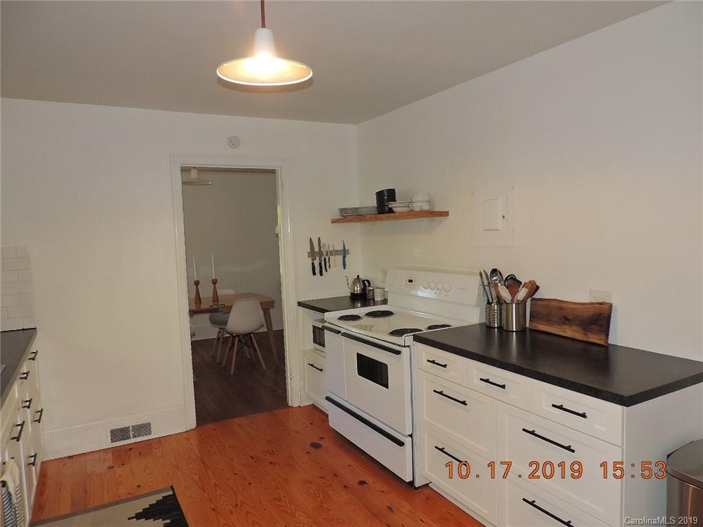 5908 Tuckaseegee Road Charlotte, NC 28208 - Photo 11 of 30 a kitchen with a stove and cabinets