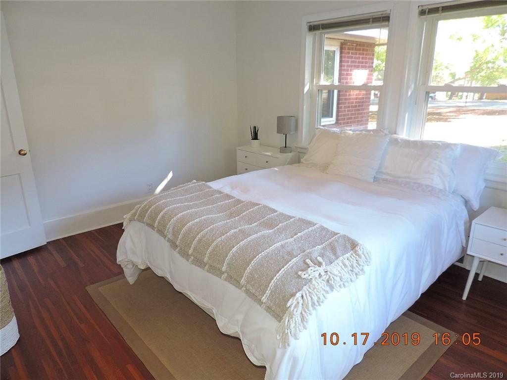 5908 Tuckaseegee Road Charlotte, NC 28208 - Photo 15 of 30 a bedroom with a bed and window