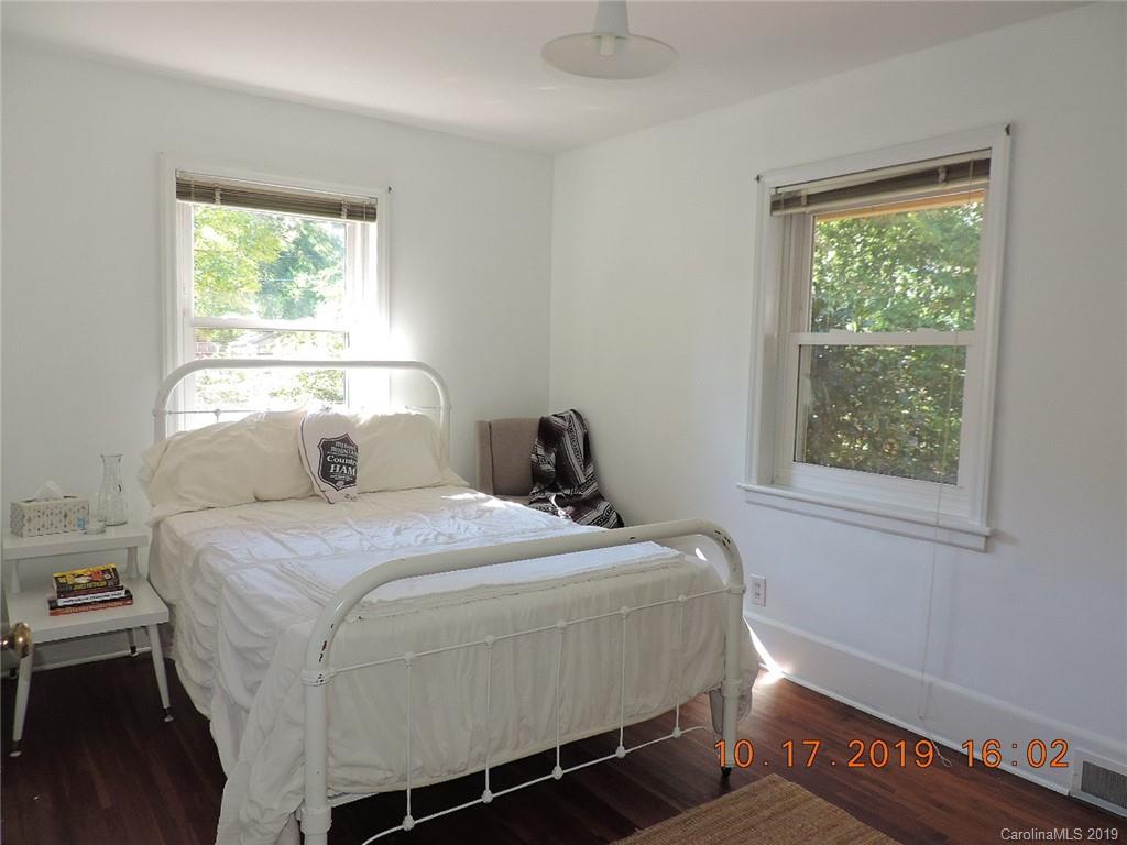 5908 Tuckaseegee Road Charlotte, NC 28208 - Photo 17 of 30 a bedroom with a bed and a window