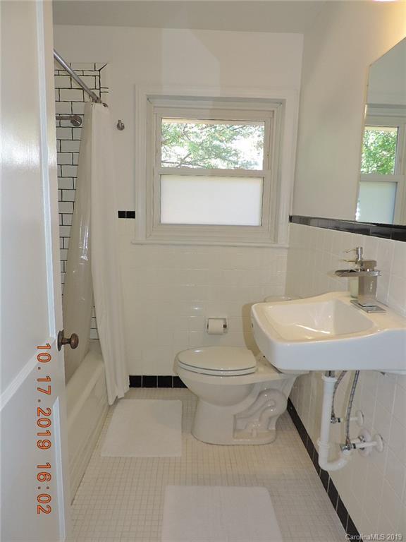 5908 Tuckaseegee Road Charlotte, NC 28208 - Photo 19 of 30 a bathroom with a sink toilet and shower