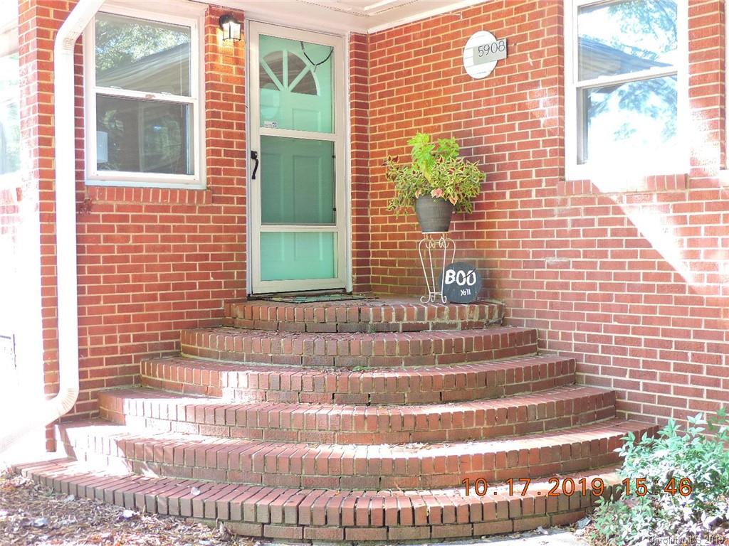 5908 Tuckaseegee Road Charlotte, NC 28208 - Photo 3 of 30 a view of a brick house with a large window