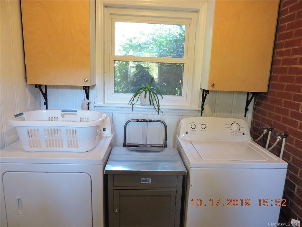 5908 Tuckaseegee Road Charlotte, NC 28208 - Photo 23 of 30 a utility room with dryer and washer