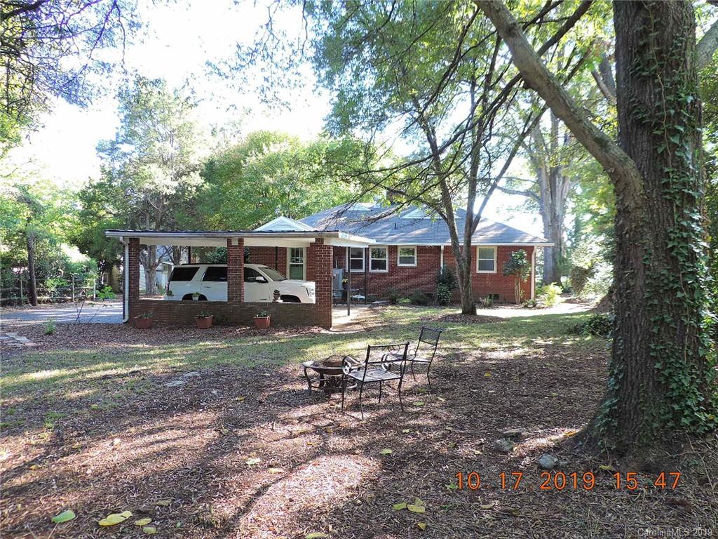 5908 Tuckaseegee Road Charlotte, NC 28208 - Photo 25 of 30 a front view of a house with garden