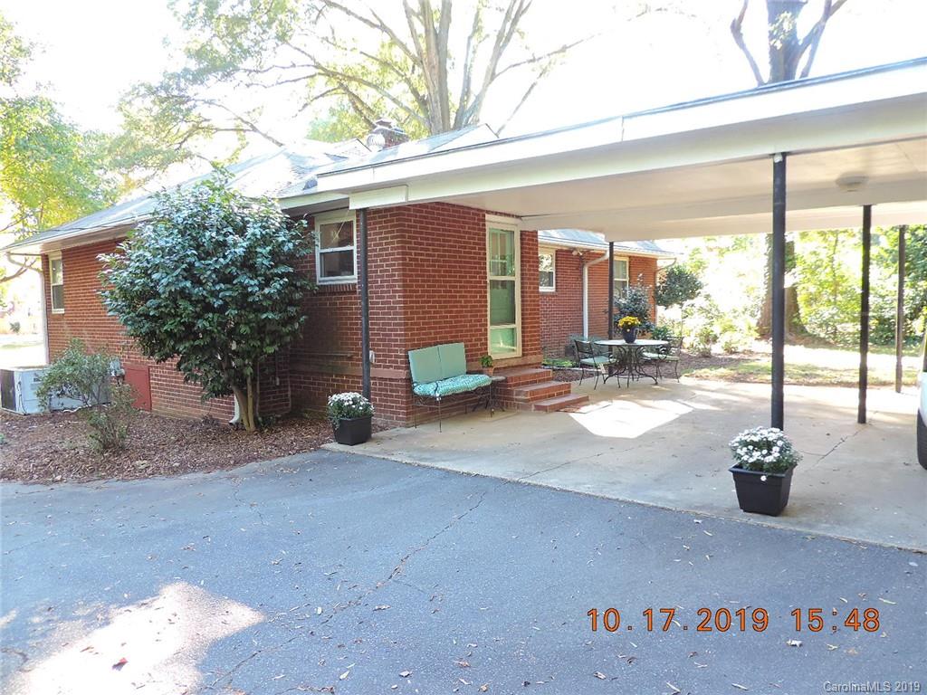 5908 Tuckaseegee Road Charlotte, NC 28208 - Photo 26 of 30 a view of a house with porch and sitting area