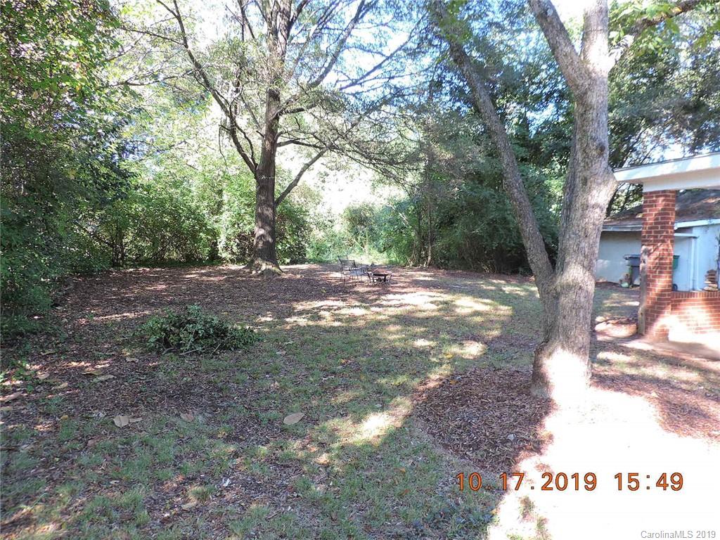 5908 Tuckaseegee Road Charlotte, NC 28208 - Photo 27 of 30 a view of a yard with large trees