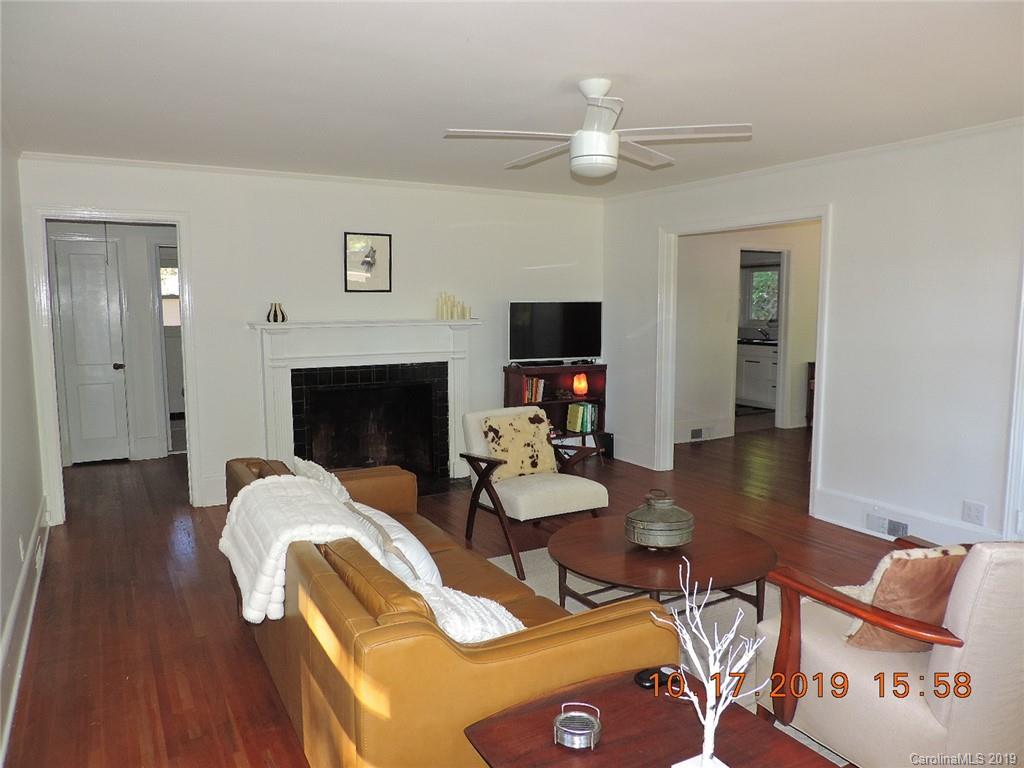 5908 Tuckaseegee Road Charlotte, NC 28208 - Photo 5 of 30 a living room with furniture and a fireplace