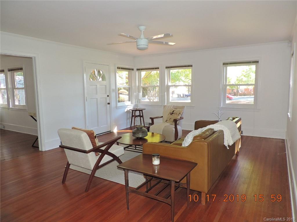 5908 Tuckaseegee Road Charlotte, NC 28208 - Photo 6 of 30 a view of a dining room with furniture window and wooden floor