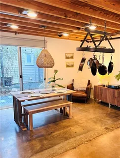 a living room with furniture and a table