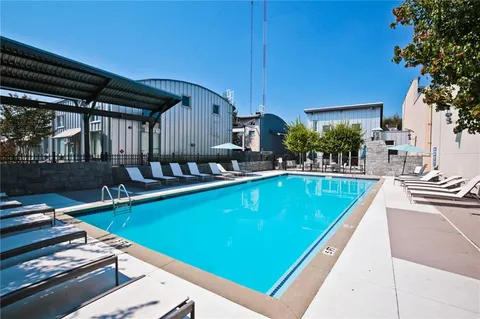 a view of a swimming pool with a patio