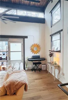 a bedroom with a bed and window