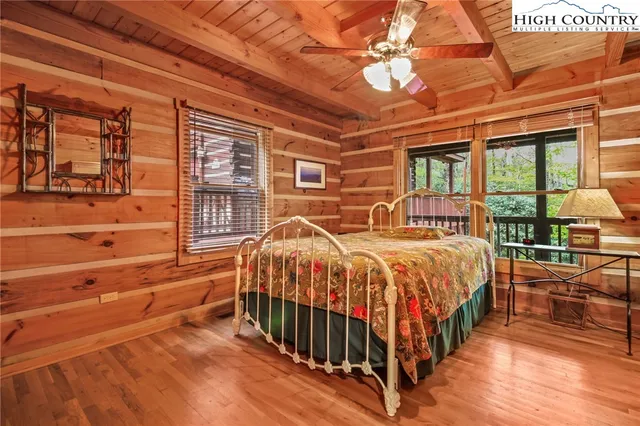 a bedroom with bed and a window