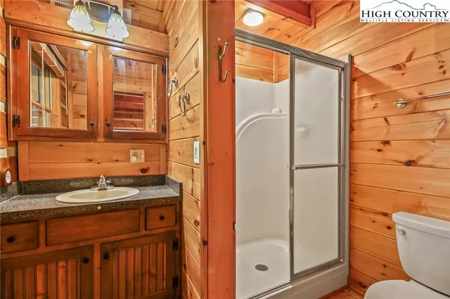 a bed sitting in a room next to a window