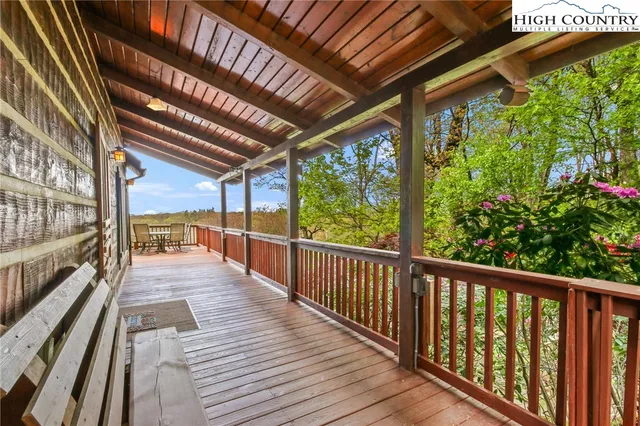 a room with pool table and windows