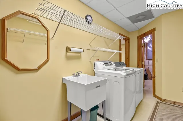 a bed room with a bed and a chair