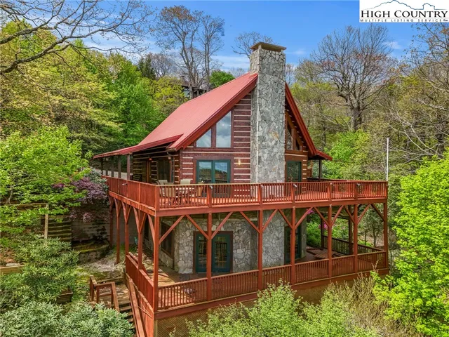 an aerial view of a house with swimming pool