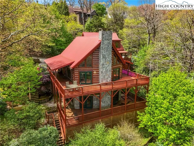 a view of a house with a yard and garden