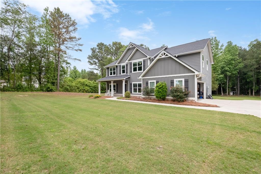 719 Fairview Road Brooks, GA 30205 - Photo 7 of 35 a front view of a house with a garden