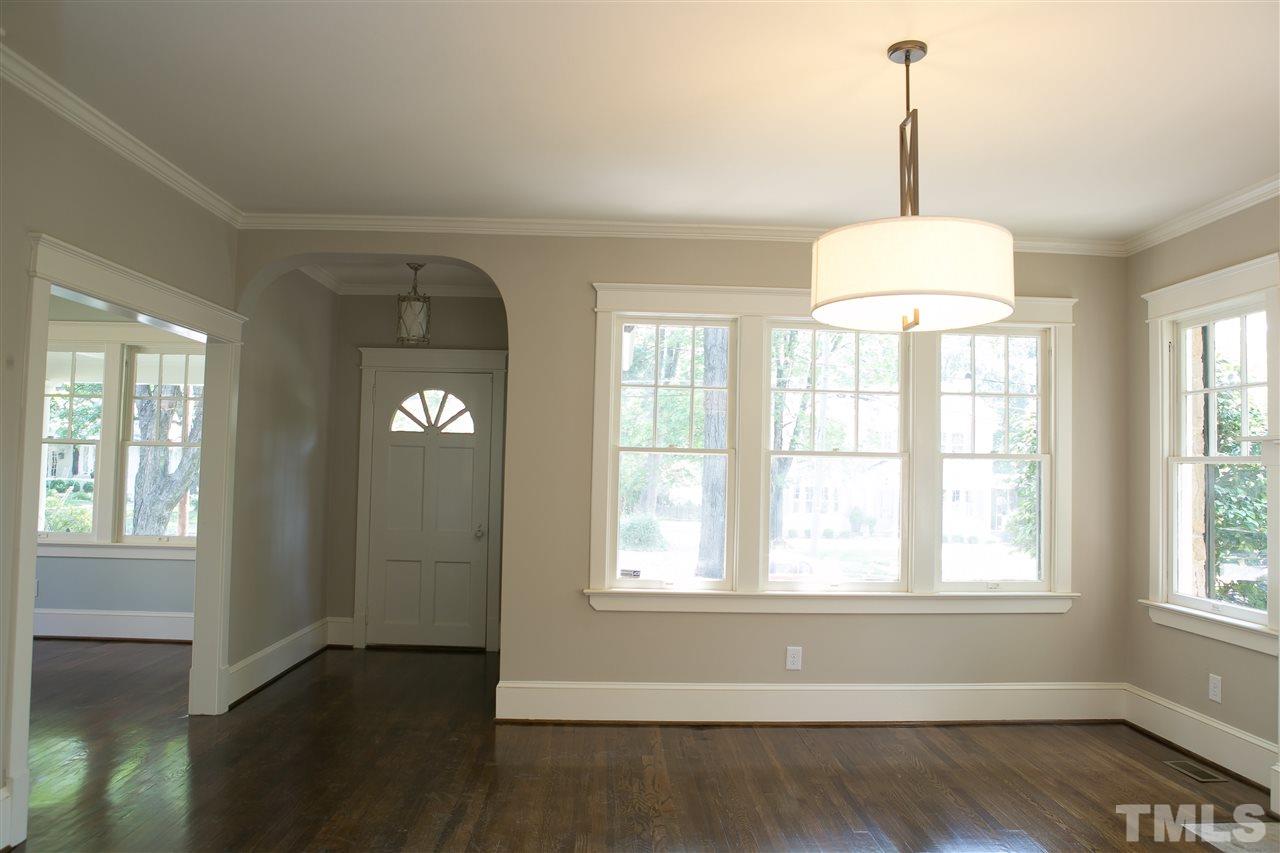 2015 St Marys Street Raleigh, NC 27608 - Photo 3 of 13 a view of an empty room with wooden floor and a window