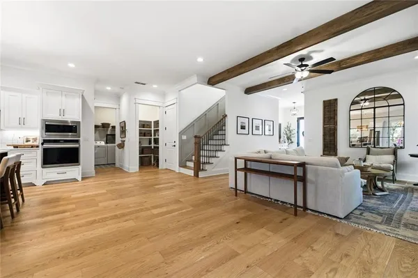 a bathroom with a double vanity sink mirror and shower