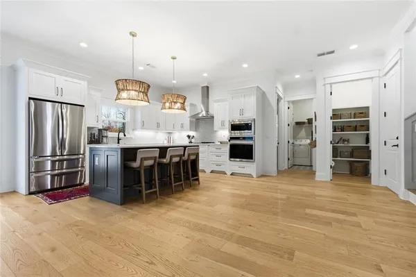 a view of a room with wooden floor and stairs