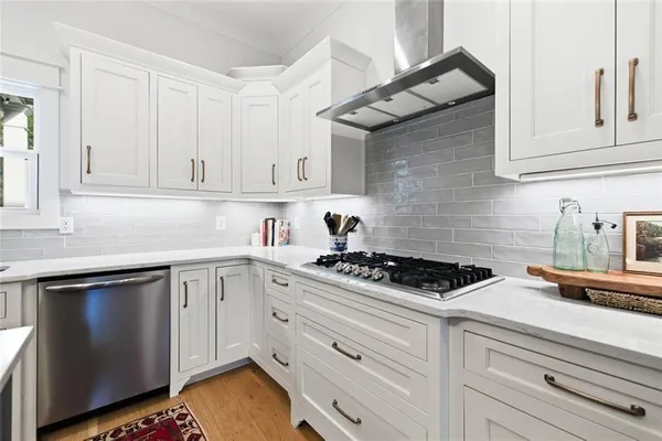 a bathroom with a toilet a sink and a mirror