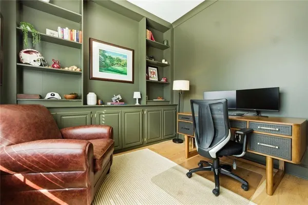 a living room with furniture a dining table and chairs