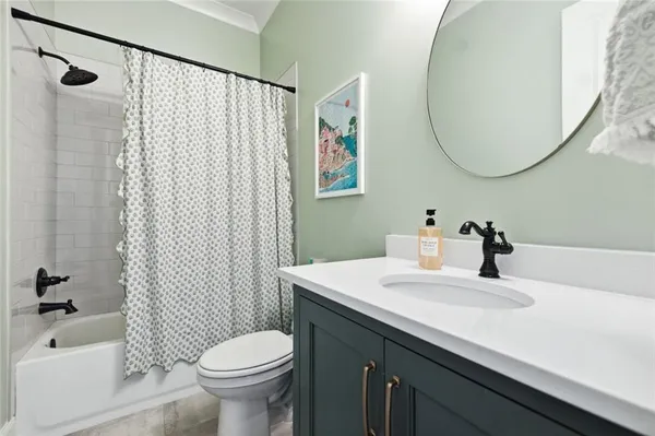 a kitchen with stainless steel appliances kitchen island granite countertop a refrigerator and a sink