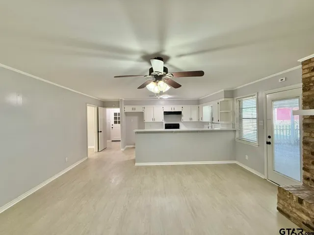 a view of a kitchen with a sink cabinets and a window