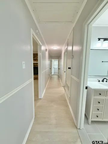 a view of a hallway with closet