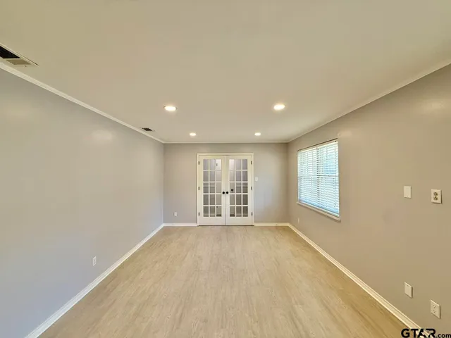 a view of an empty room with a window